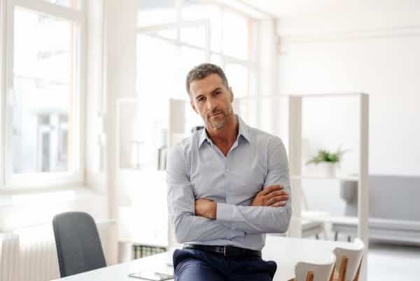 Businessman folding his arms